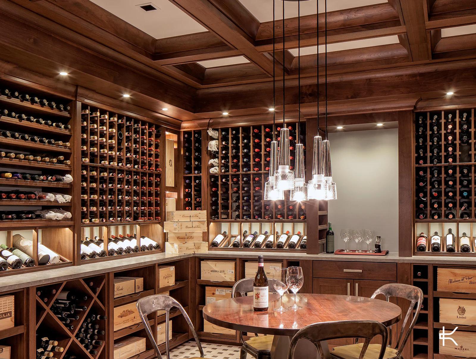A timber wine room with a coffered ceiling around a tasting table.